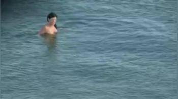 video of emerging from the ocean naked