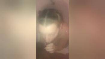 video of White girl sucking cock under the shower