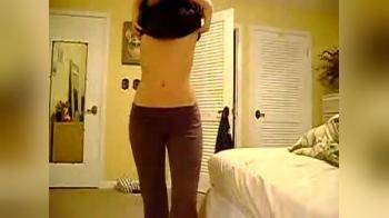 video of Hot skinny brunette on her bed playing with herself