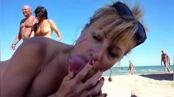 video of Milf sucks cock in a crowded beach