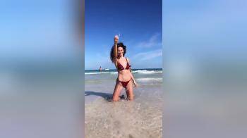 video of amazing curly haired babe at the beach