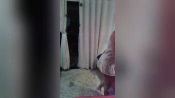 video of Marília Meira  dancing in front of the TV