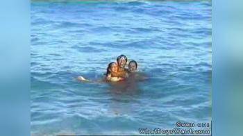video of two topless girls at beach
