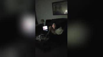 video of Horny girl watching porn and fingering pussy on the couch  spy cam