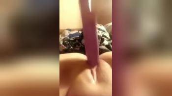 video of Using a large dildo on her pussy