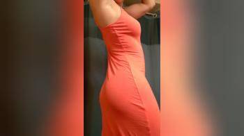 video of Girl teasing in a peach dress