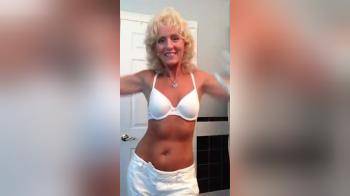 video of Older Milf stripping down topless
