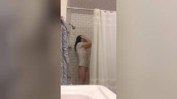 video of Taking a shower in white t-shirt bottomless 