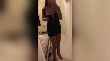 video of Filming herself in the mirror stripping down naked
