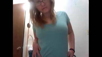 video of Nerdy blonde strips naked in front of cam