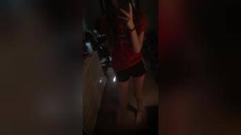 video of Striping in mirror dark room cute girl