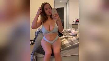 video of big girl on bed filming herself