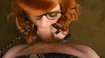video of Redhead slave girl on her knees sucking cock