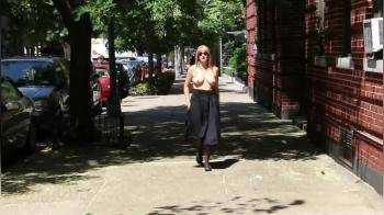 video of She is walking topless on street