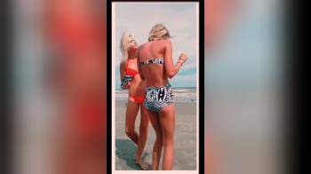 video of Hot blonde bikini sisters feed seagulls