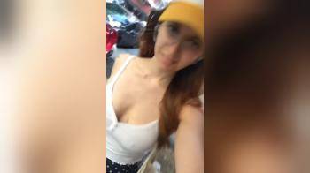 video of Filming herself walking down the street bouncing tits