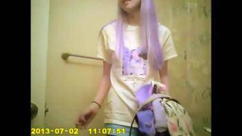 video of purple haired teen in bathroom