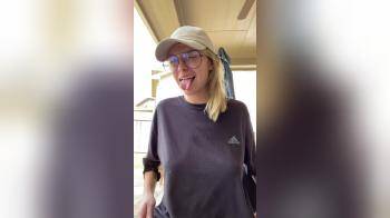 video of Cute blonde with glasses flashes her tits