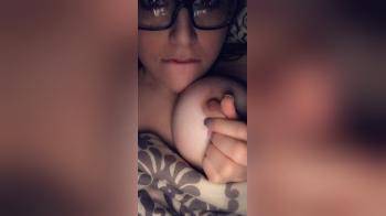 video of cute glasses girl sucking own nipples