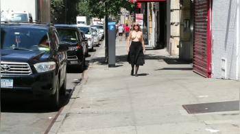 video of Walking down the street topless as a dare