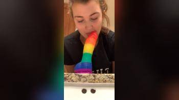 video of rainbow colored dildo cute girl shows her skills on it