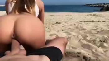 video of Girl as reverse cowgirl In the beach