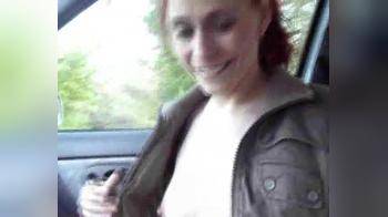 video of redhead woman sucks off a stranger in the car