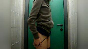 video of girl shoves a weird object in her twat in public toilet