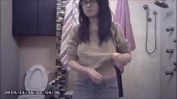 video of Geeky teen with nice tits undressing
