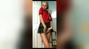 video of skinny blonde with ponytails and short skirt flashing