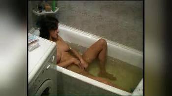 video of Brunette baiting in the bath on hidden camera