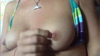 video of tits out of her bikini playing with them