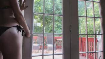 video of with her dildo in front of the window