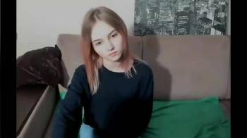 video of Girl sits behind the cam and undresses