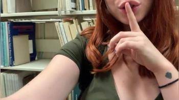 video of redhead with an affinity for showing off her tits in libraries