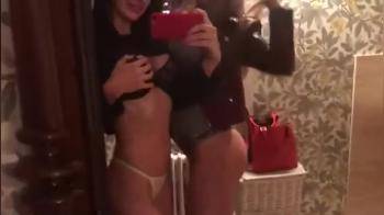 video of Two girls film themselves in the bathroom kissing