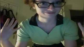 video of nerd looking slim teen strips on webcam