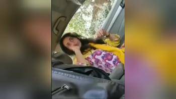 video of He pursuades her to suck his cock in the car, she finally does it