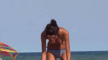 video of Topless skinny hottie at the beach