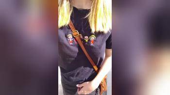 video of Blonde walking on the street and flashing her tits