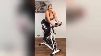 video of Sporty girl has a dildo for a bike seat