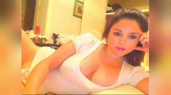 video of Pretty brunette rubs pussy on webcam
