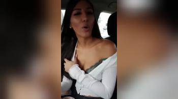 video of She shows her breasts in the car