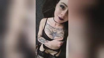 video of tatted goth girl shows off body