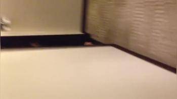 video of Nude walks down a hotel corridor