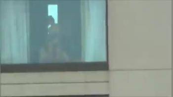 video of Watching a couple fuck in front of a window