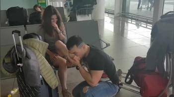 video of Licking his wife feet at the airport