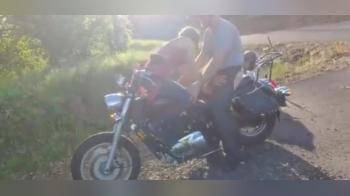video of girl sucking dick in an uncomfortable but funny position on a motorbike