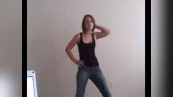 video of Dancing and stripping in front of the camera