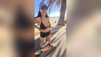 video of Flashing her tits while riding her board